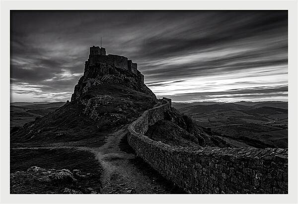Hilltop Castle Silhouetted Against Sunset