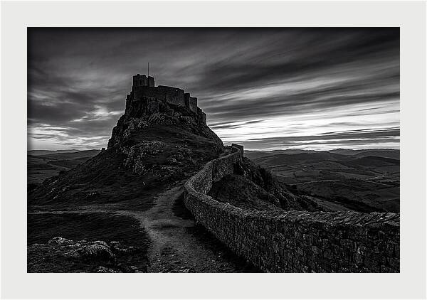 Hilltop Castle Silhouetted Against Sunset