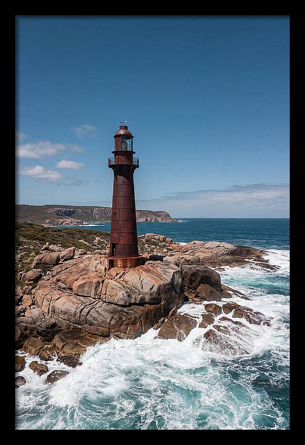 Historic Iron Lighthouse Against Waves