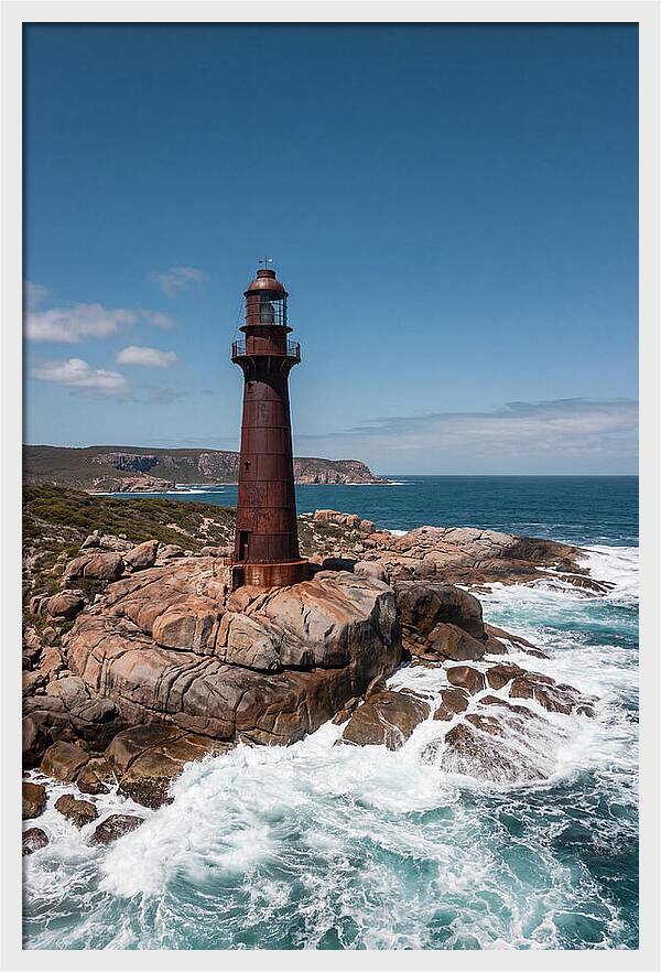 Historic Iron Lighthouse Against Waves