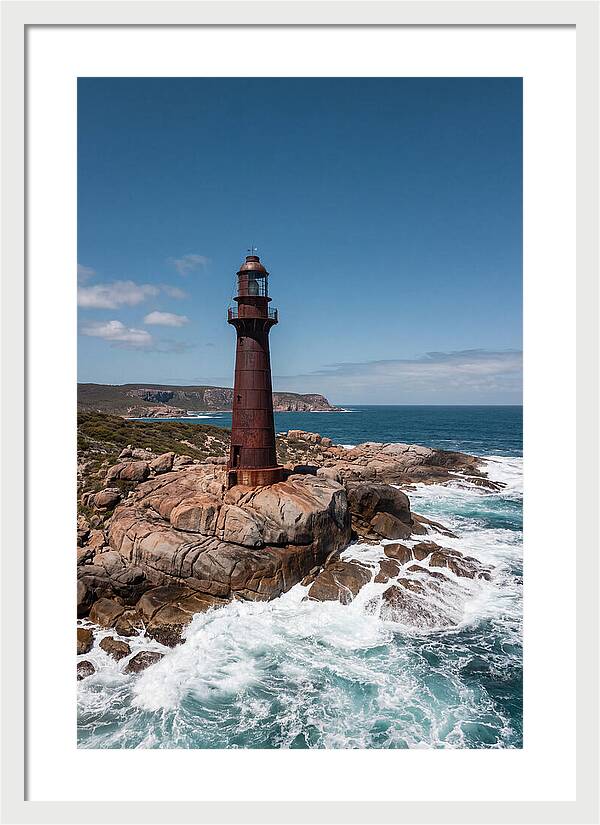 Historic Iron Lighthouse Against Waves