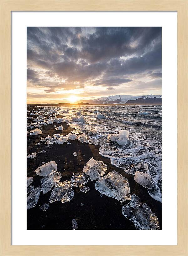 Icebergs At Sunset On Black Sand