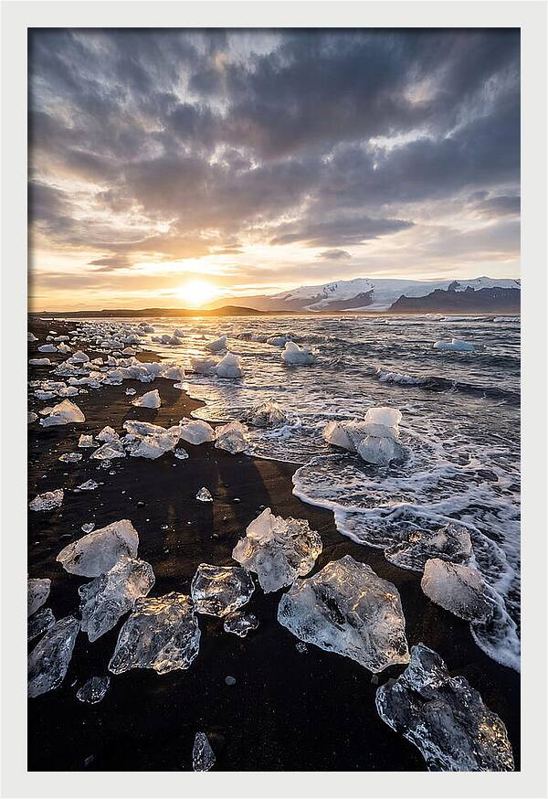 Icebergs At Sunset On Black Sand