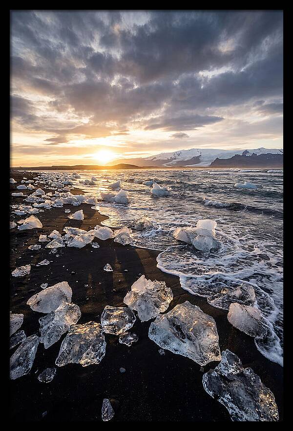 Icebergs At Sunset On Black Sand