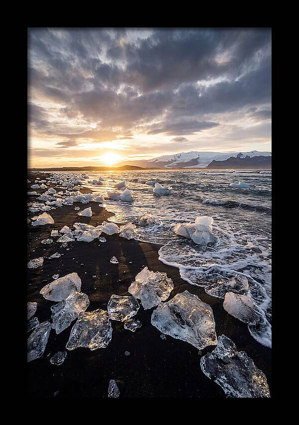 Icebergs At Sunset On Black Sand