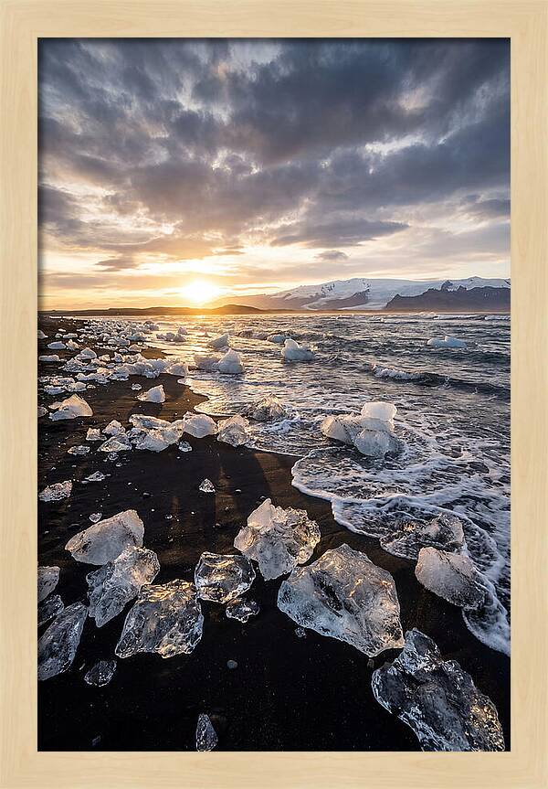 Icebergs At Sunset On Black Sand