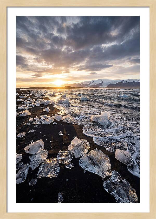 Icebergs At Sunset On Black Sand