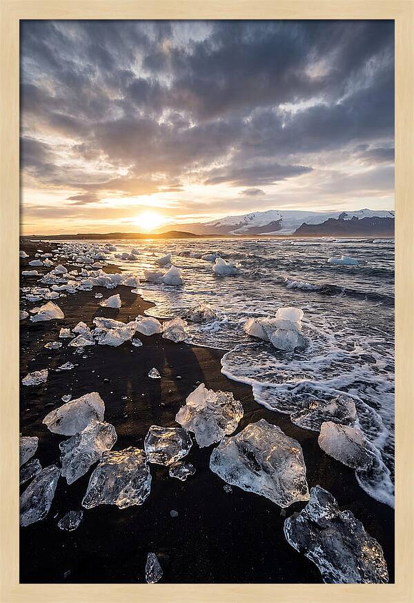 Icebergs At Sunset On Black Sand
