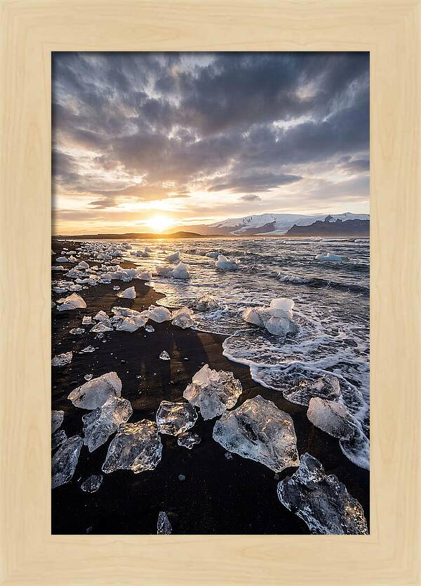 Icebergs At Sunset On Black Sand