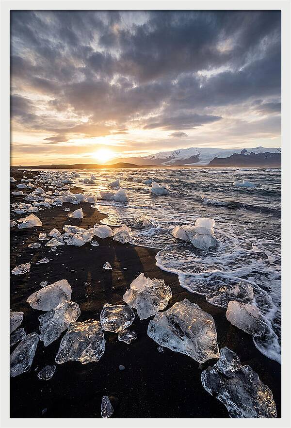 Icebergs At Sunset On Black Sand