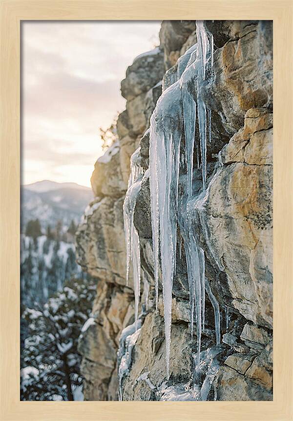 Icicles Hanging From Rocky Cliff