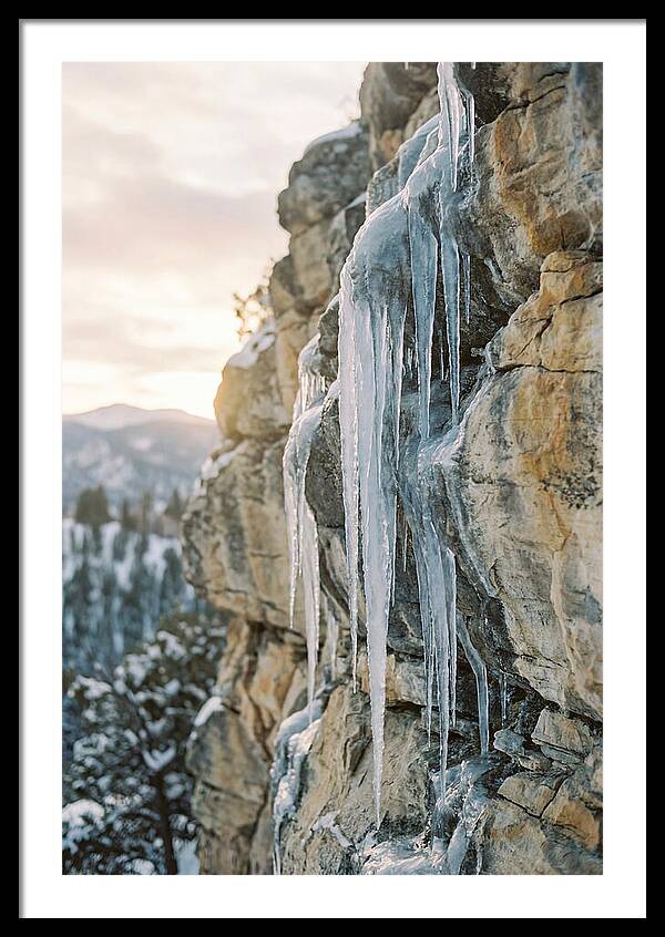 Icicles Hanging From Rocky Cliff