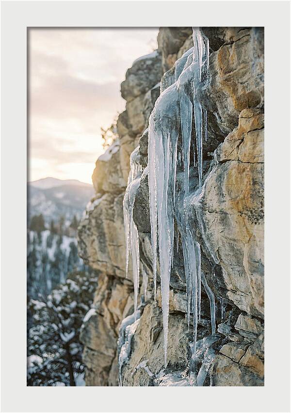 Icicles Hanging From Rocky Cliff