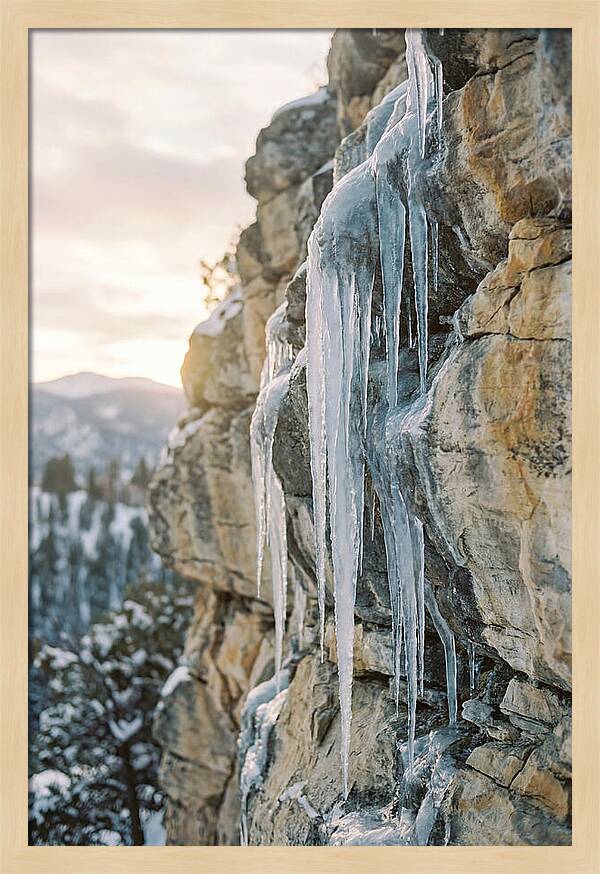 Icicles Hanging From Rocky Cliff