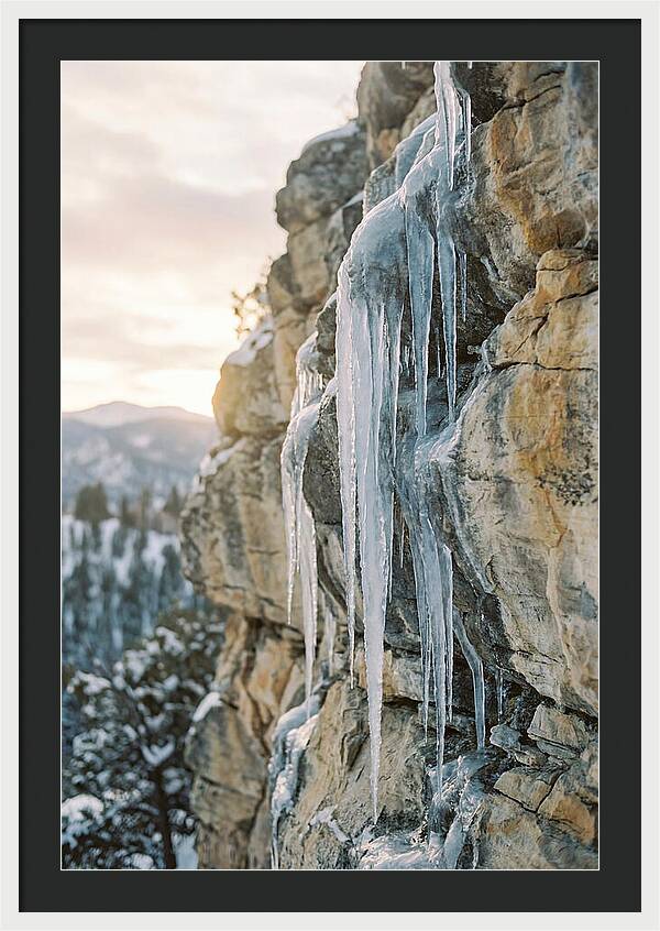 Icicles Hanging From Rocky Cliff