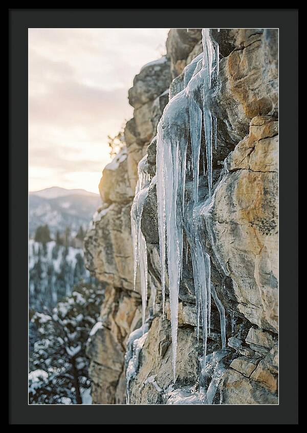 Icicles Hanging From Rocky Cliff