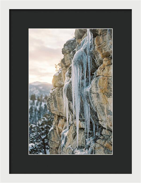 Icicles Hanging From Rocky Cliff