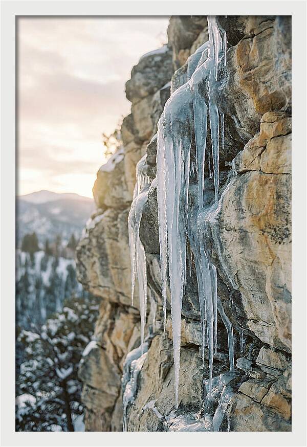 Icicles Hanging From Rocky Cliff