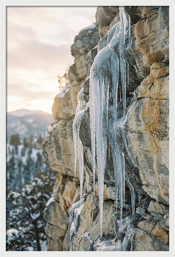 Icicles Hanging From Rocky Cliff