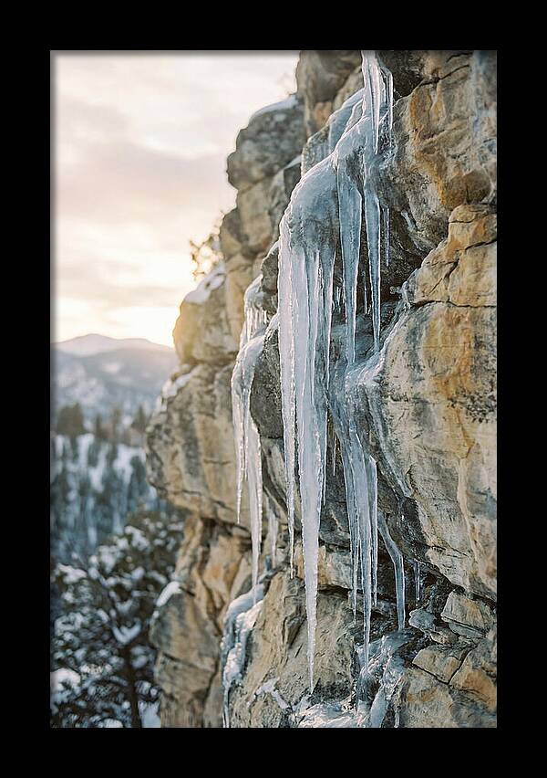 Icicles Hanging From Rocky Cliff