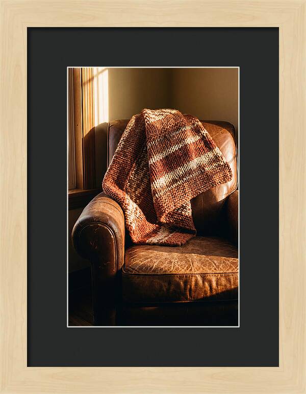 Knitted Blanket Over Leather Chair