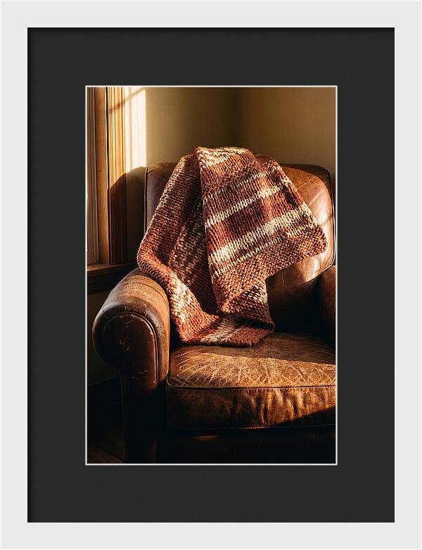Knitted Blanket Over Leather Chair