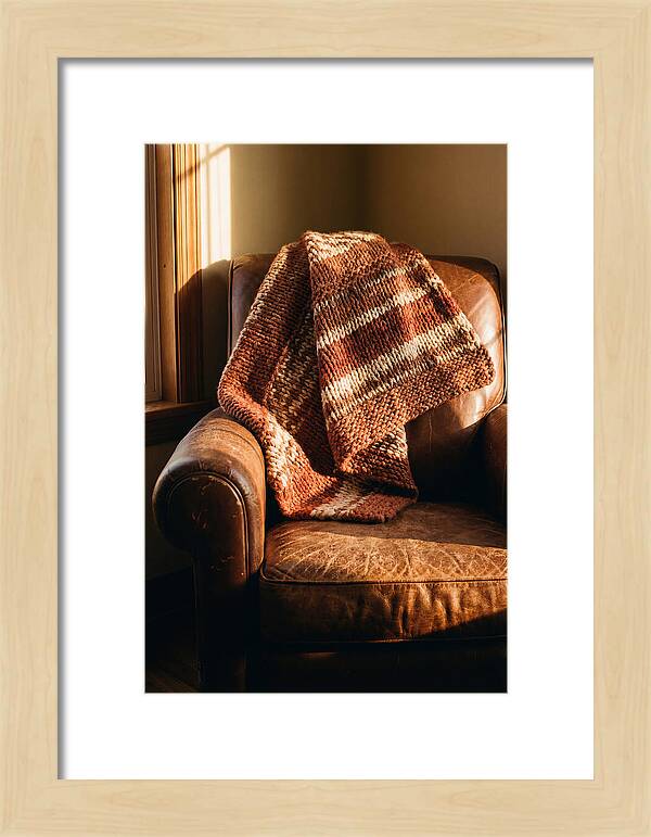 Knitted Blanket Over Leather Chair