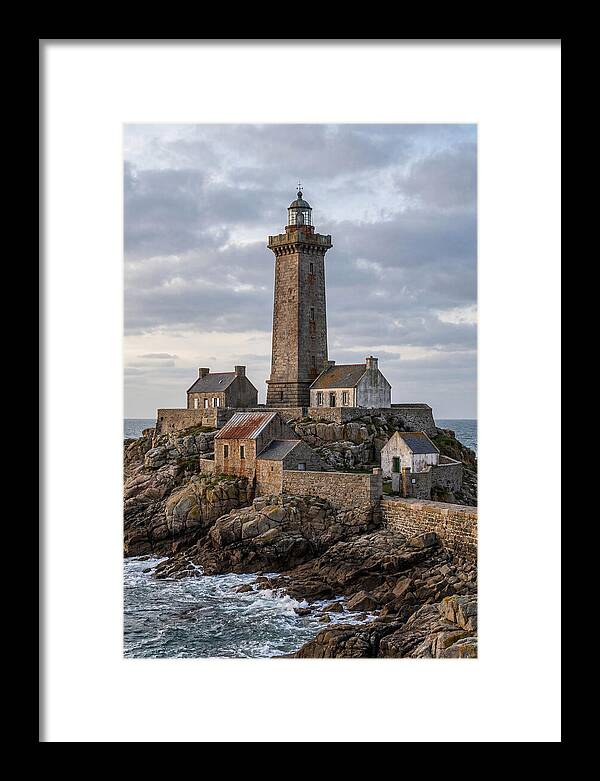 Lighthouse On Rocky Shoreline