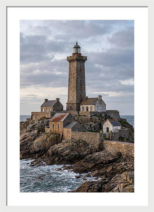 Lighthouse On Rocky Shoreline