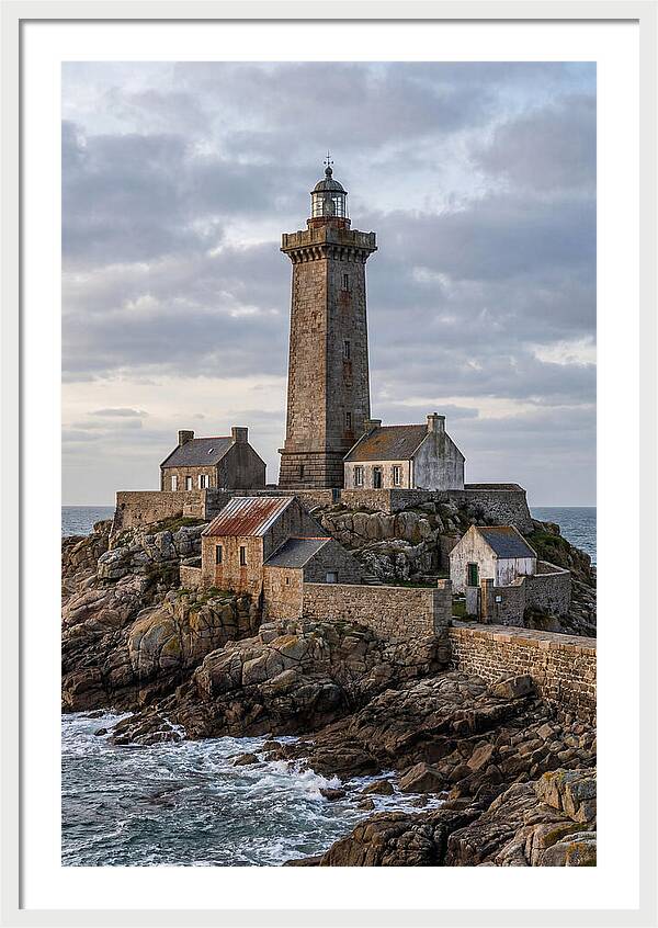 Lighthouse On Rocky Shoreline