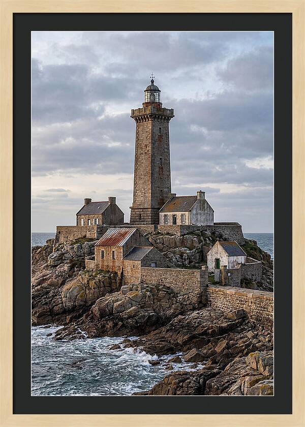 Lighthouse On Rocky Shoreline