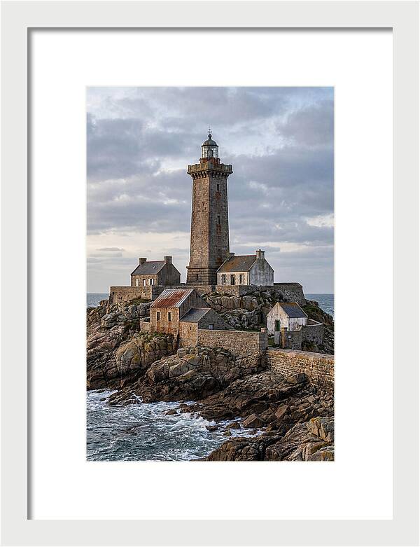 Lighthouse On Rocky Shoreline