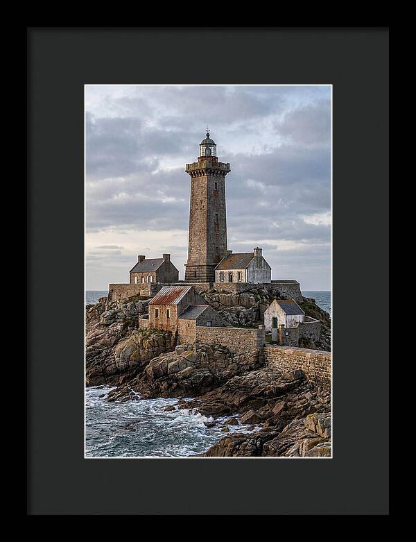 Lighthouse On Rocky Shoreline