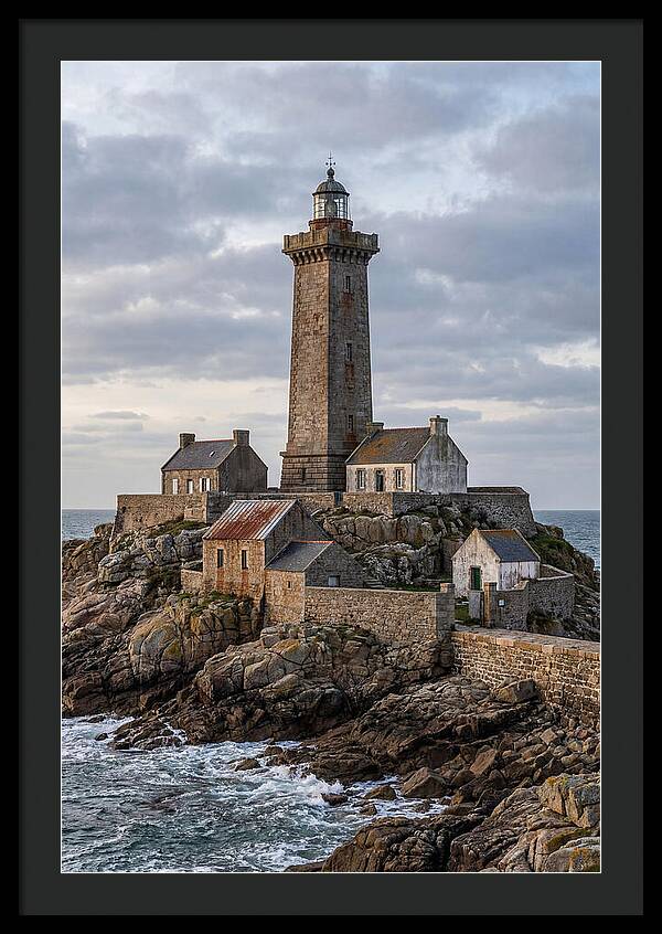 Lighthouse On Rocky Shoreline