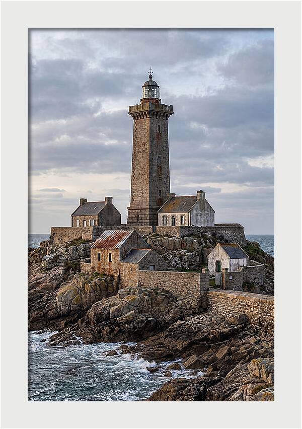 Lighthouse On Rocky Shoreline