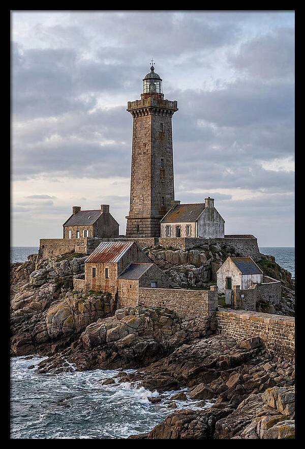 Lighthouse On Rocky Shoreline