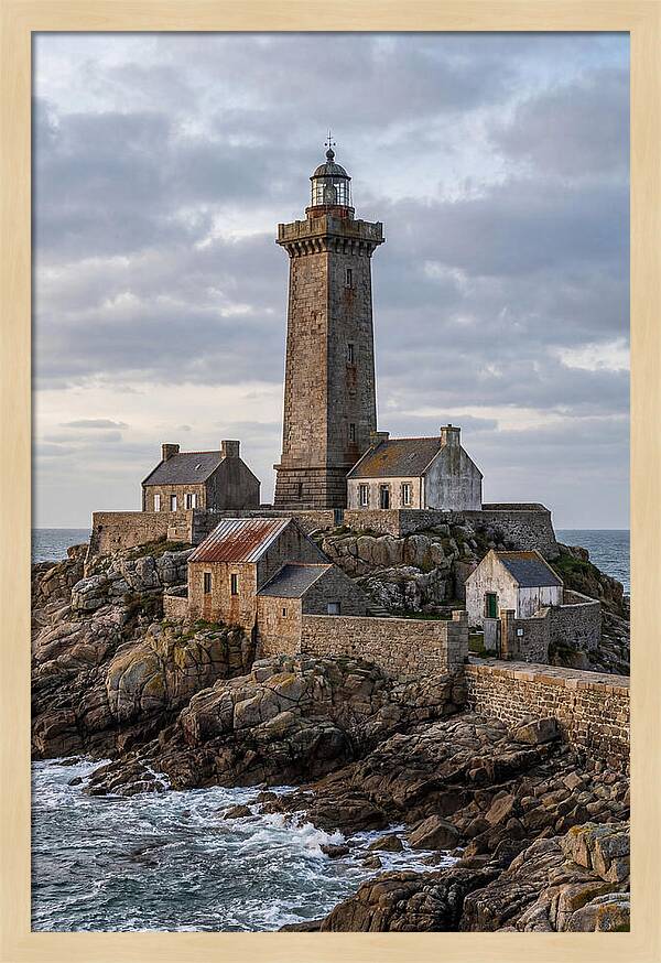 Lighthouse On Rocky Shoreline