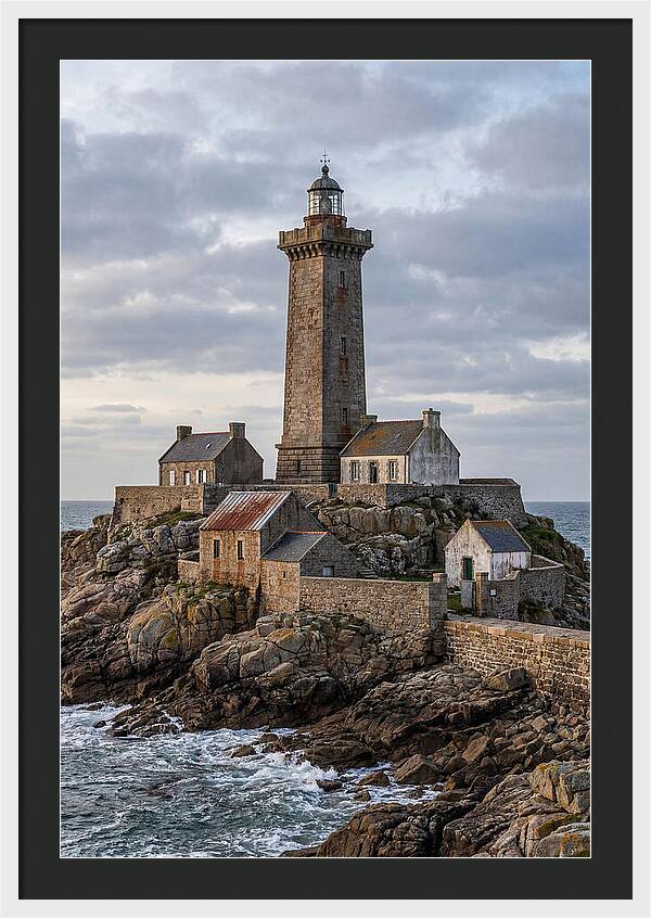 Lighthouse On Rocky Shoreline