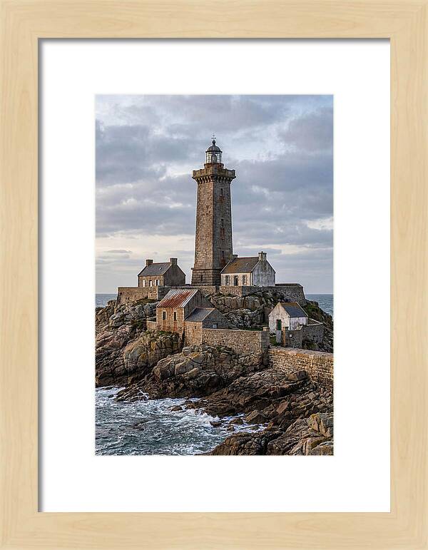 Lighthouse On Rocky Shoreline