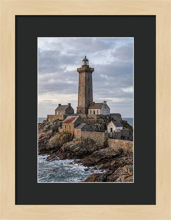 Lighthouse On Rocky Shoreline