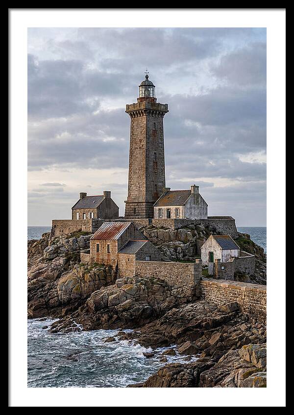 Lighthouse On Rocky Shoreline