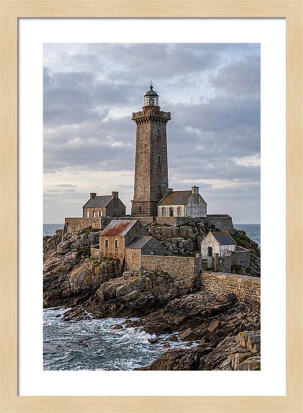 Lighthouse On Rocky Shoreline