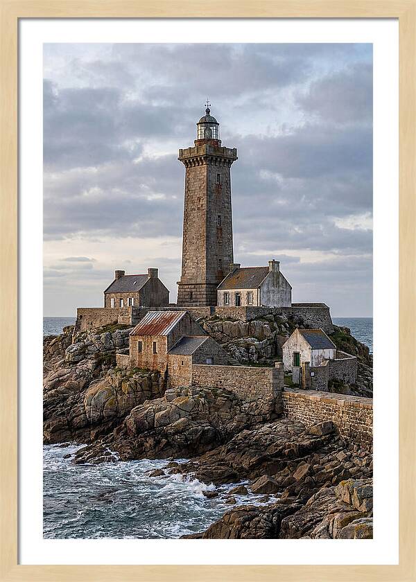 Lighthouse On Rocky Shoreline