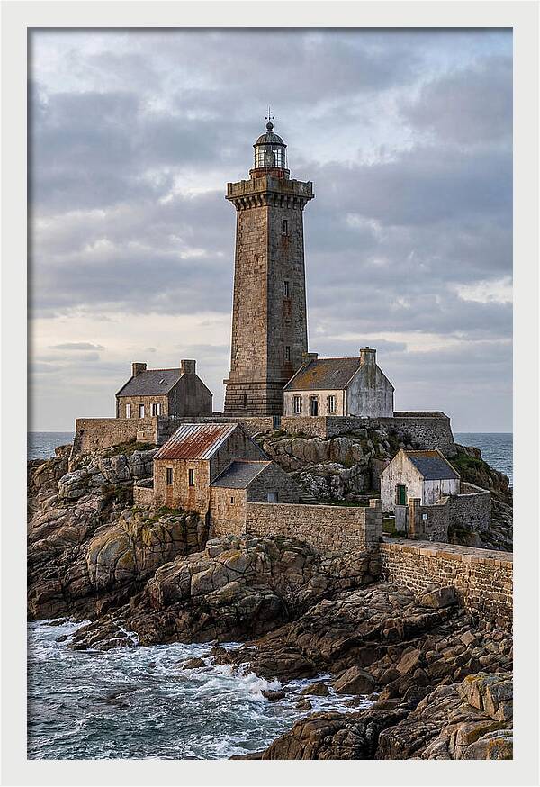 Lighthouse On Rocky Shoreline