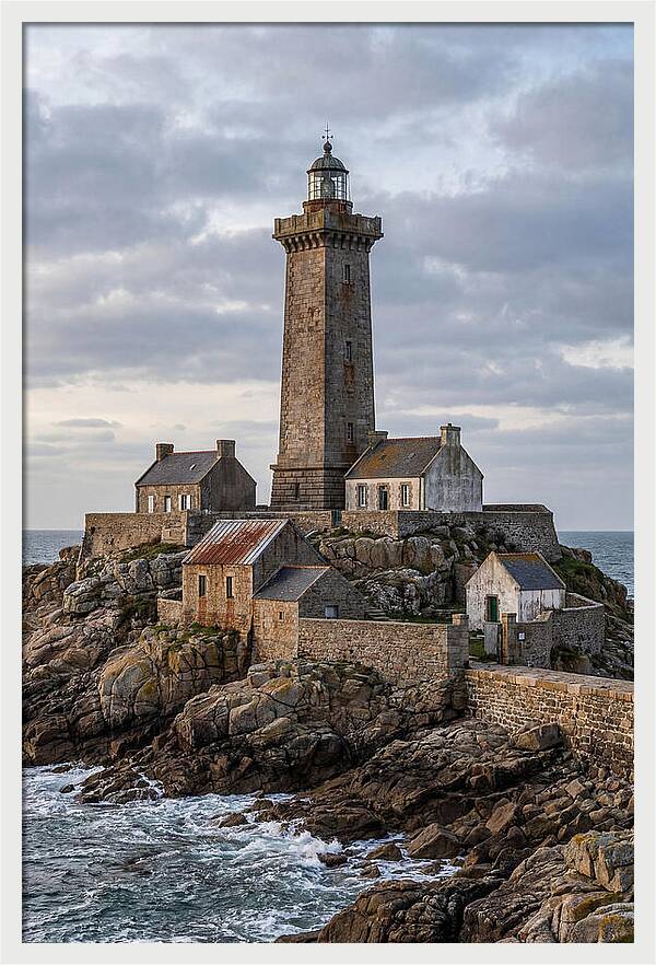 Lighthouse On Rocky Shoreline