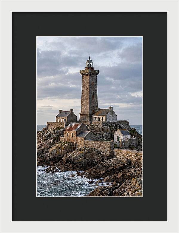 Lighthouse On Rocky Shoreline