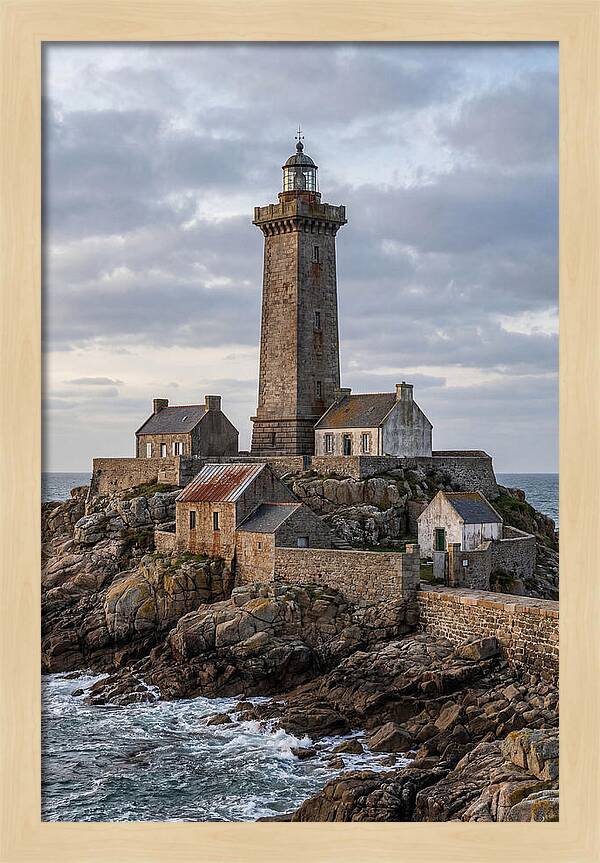 Lighthouse On Rocky Shoreline