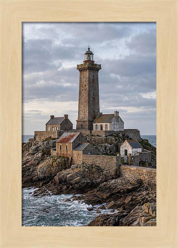Lighthouse On Rocky Shoreline