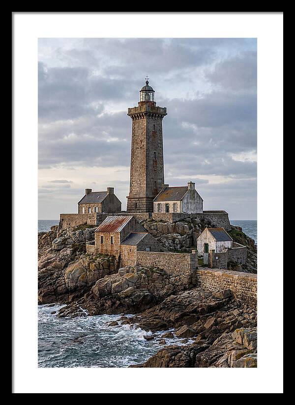 Lighthouse On Rocky Shoreline