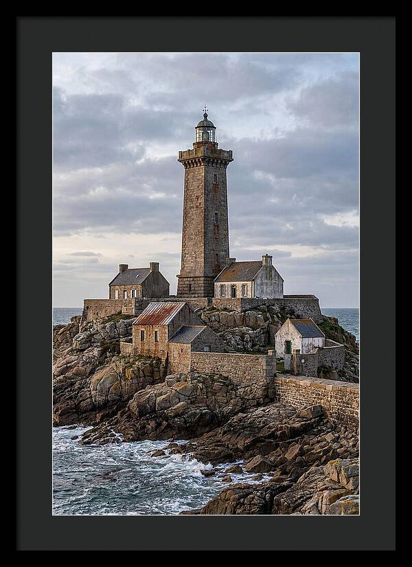 Lighthouse On Rocky Shoreline